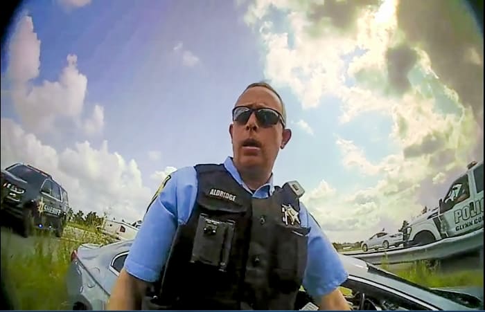 Georgia deputy who shot absolved man had prior firing for excessive force. Critics blame the sheriff
