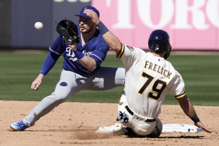 Freeman reaches 3 times, scores in Dodgers debut, beats Rox