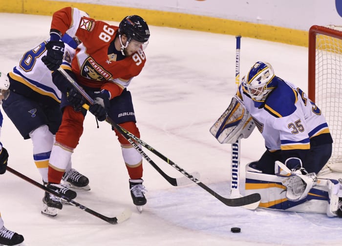 David Perron's hat trick helps Blues beat Wild, seize home ice