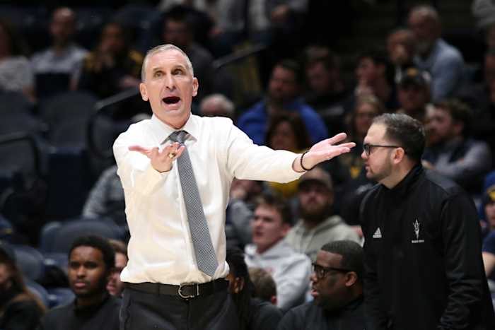Arizona State coach Bobby Hurley waves players off court after testy finish against rival Arizona