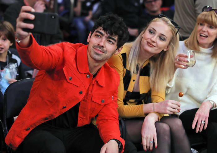 Sophie Turner at Emmys in pink Louis Vuitton as Joe Jonas calls