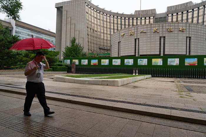 China launches a blitz of policies to help its economy, plans talks with the US on trade