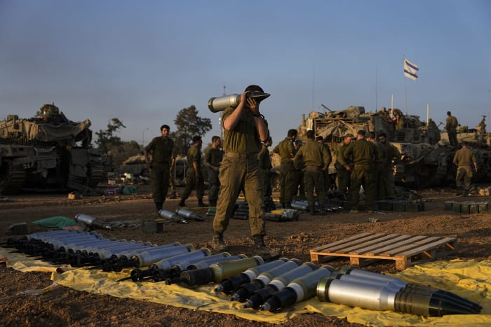 Fighting in southern Gaza city after Israel says it is pulling thousands of troops from other areas