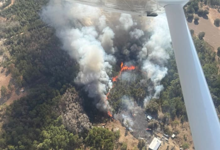 Crews contain fast-moving wildfire in Putnam County, protecting 25 homes from ‘erratic’ flames