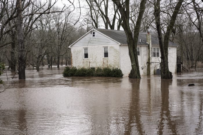 Major cleanup underway after storm batters Northeastern US, knocks out power and floods roads