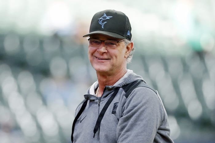 Toronto Blue Jays manager John Schneider, right, laughs as he