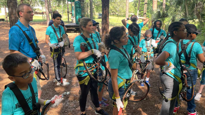 Children with vision impairments take tree trek ropes course with Central Florida nonprofit’s help