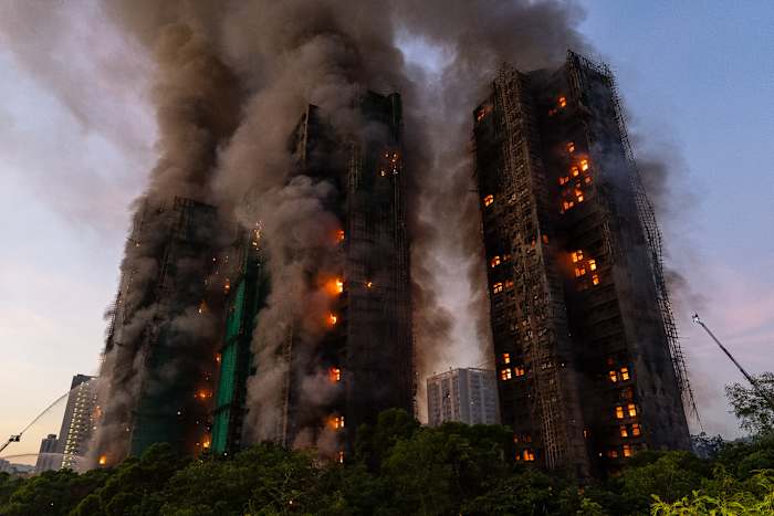 Hong Kong charges 7 people and 2 firms over deadly