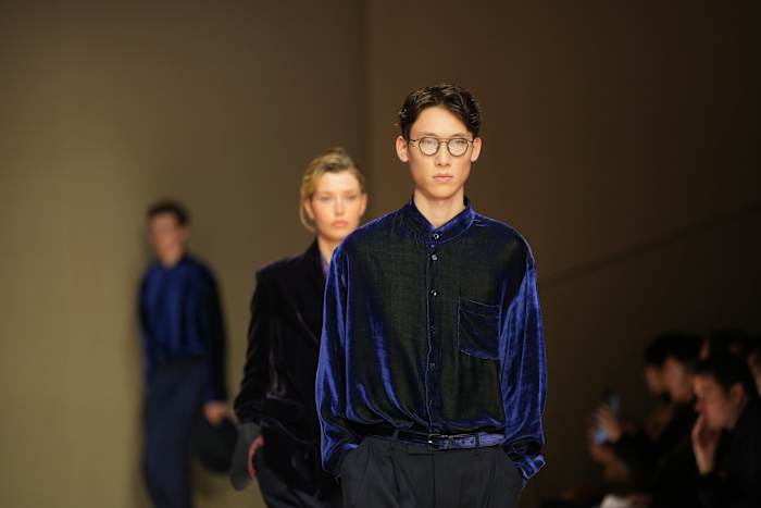 Giorgio Armani launches new era with iridescent colors and a star