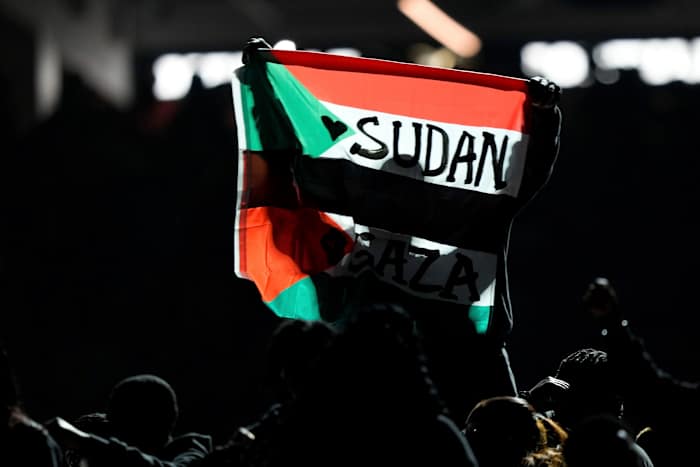 Super Bowl halftime performer arrested after police say he held flag stating ‘Sudan and Free Gaza.’ Super Bowl halftime performer arrested after police say he held flag stating ‘Sudan and Free Gaza.’