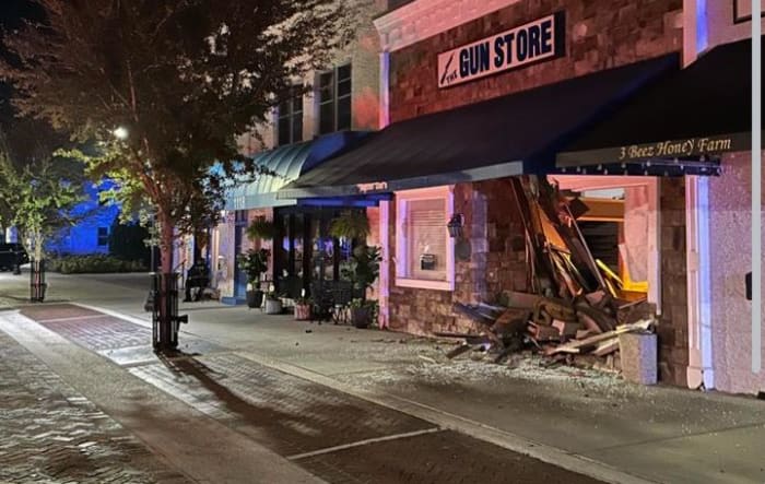 Car crashes into downtown St. Cloud gun store