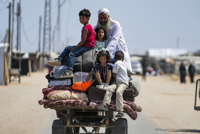 An Israeli airstrike hits a school sheltering people in Gaza, killing at least 30 including children