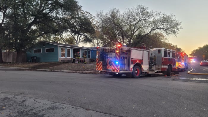 Flames burn through roof after air conditioning unit causes fire in vacant house, SAFD says