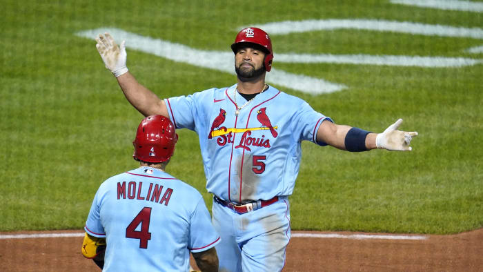 Cardinals reliever Gallegos gets wiped down by umpire after using rosin bag  on his left arm