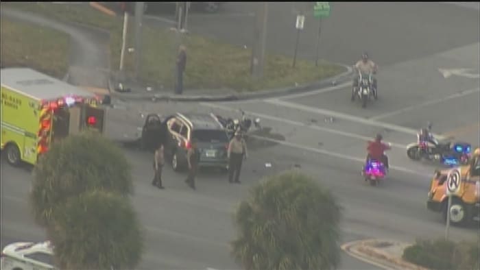 Police motorman, SUV collide in northwest Miami-Dade