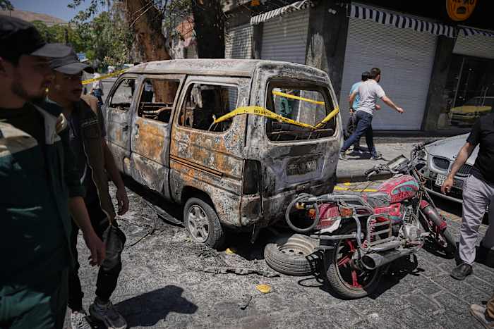 Explosions rock Syria's capital as French President Macron visits