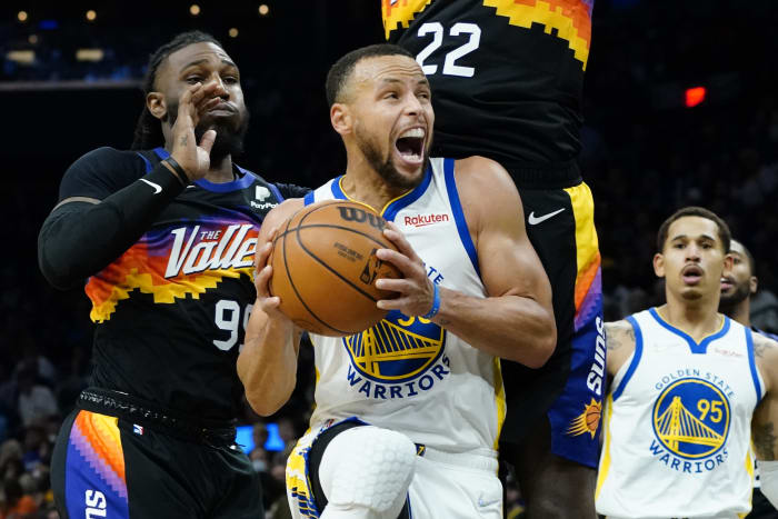 Golden State Warriors guard Damion Lee, right, pours water over the head of  guard Stephen Curry (30) while celebrating Curry's career-high 62 points  against the Portland Trail Blazers in an NBA basketball