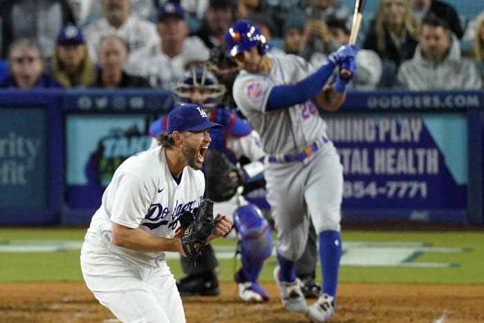 San Diego Padres' Chris Paddack applauds a catch by Hunter Renfroe