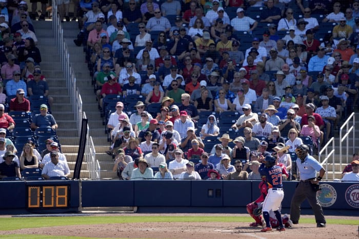 Pat Borders of the California Angels looks on from the dugout