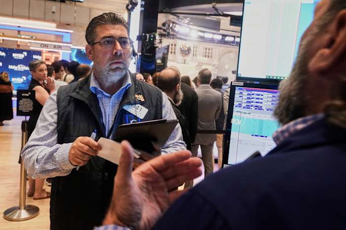 World shares are mixed in quiet trading as traders await cues from the Fed