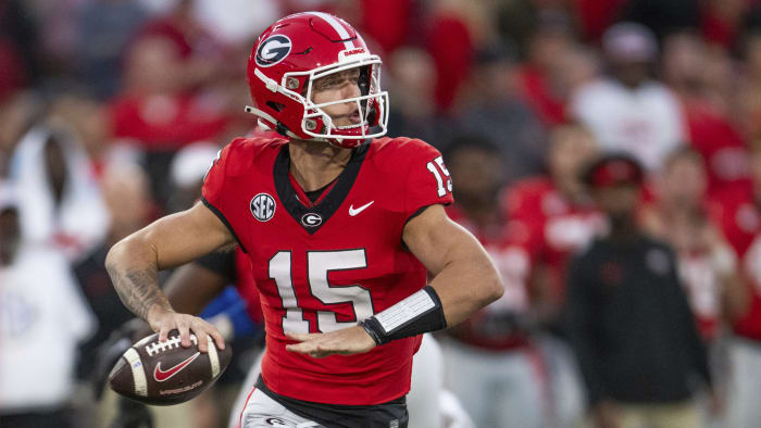 Beck throws and runs for TDs to launch new era as No. 1 Georgia