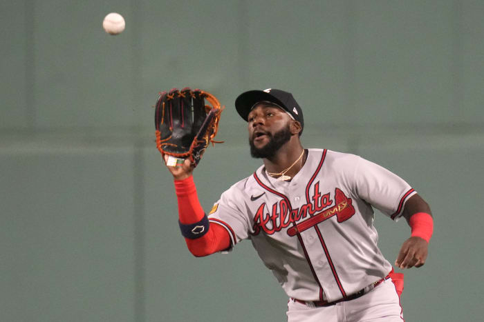 FILE - Atlanta Braves' Freddie Freeman smiles after scoring on a hit by  Marcell Ozuna against the Los Angeles Dodgers during the sixth inning in  Game 4 of a baseball National League