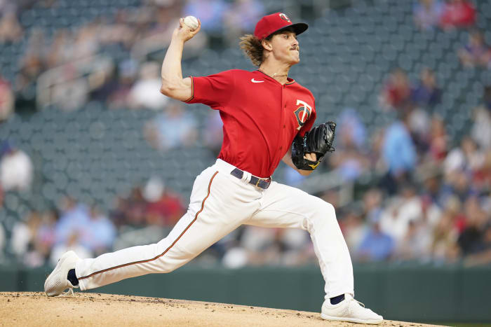 Long toss: Indians pitcher Trevor Bauer throws ball over center-field fence