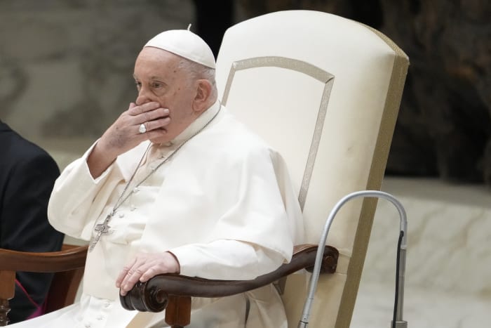 An ailing Pope Francis appears at a weekly audience but says he's not well and has aide read speech