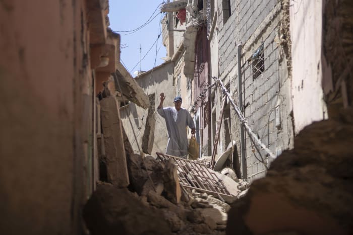Moroccan soldiers and aid teams battle to reach remote, quake-hit towns as toll rises past 2,400