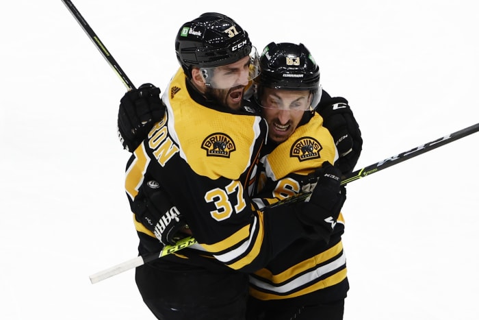 Marchand, Swayman give Bruins 4-2 win, Canes lead series 2-1