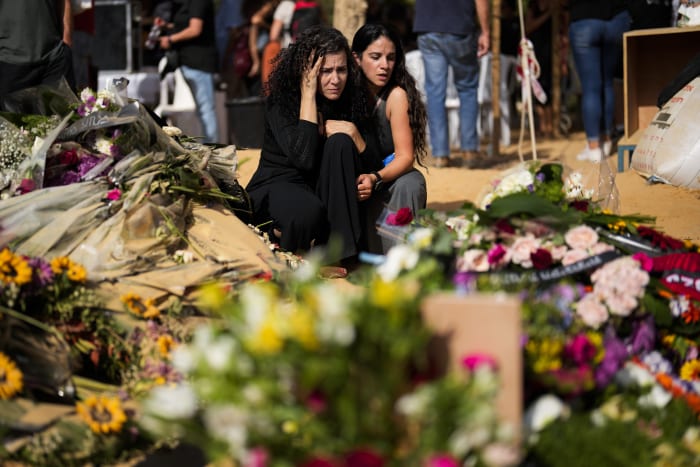 Burying friends, updating death lists: The morbid routine of displaced survivors of a Hamas massacre