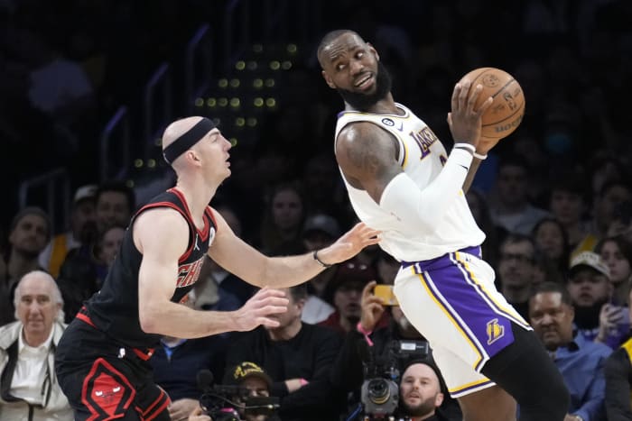 Golden State Warriors center James Wiseman (33) shoots over San Antonio  Spurs forward DeMar DeRozan during the first half of an NBA basketball game  in San Francisco, Wednesday, Jan. 20, 2021. (AP