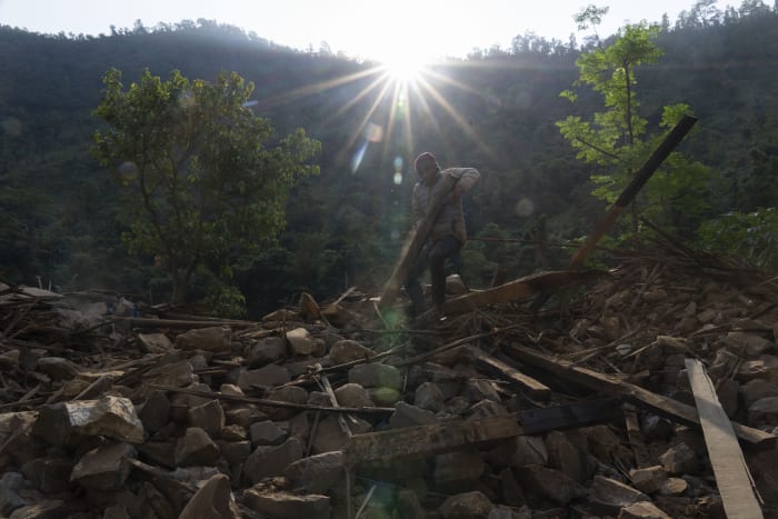 Aid trickles in to Nepal villages struck by earthquake as survivors salvage belongings from rubble