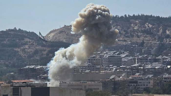 Israel strikes in Damascus as clashes between government and Druze minority rage on