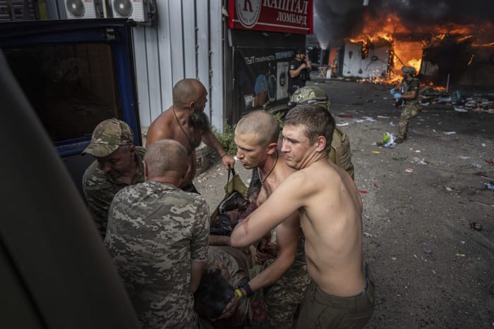 Russian missile turns Ukrainian market into fiery, blackened ruin strewn with bodies