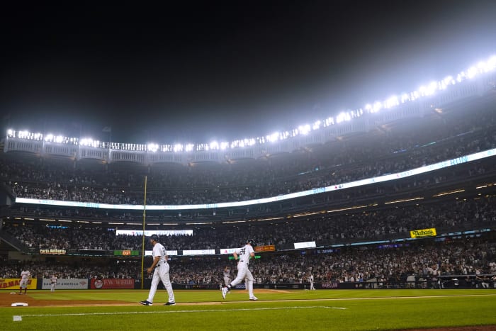 Yankees fans pelt Cleveland outfielders with debris after comeback win