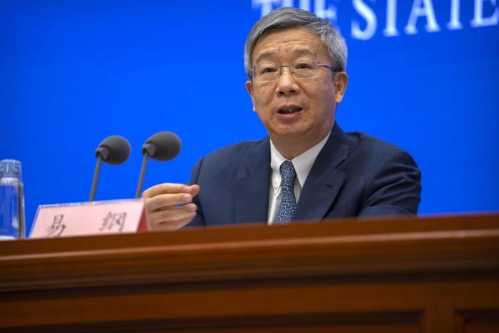 Favoring continuity, China reappoints central bank governor