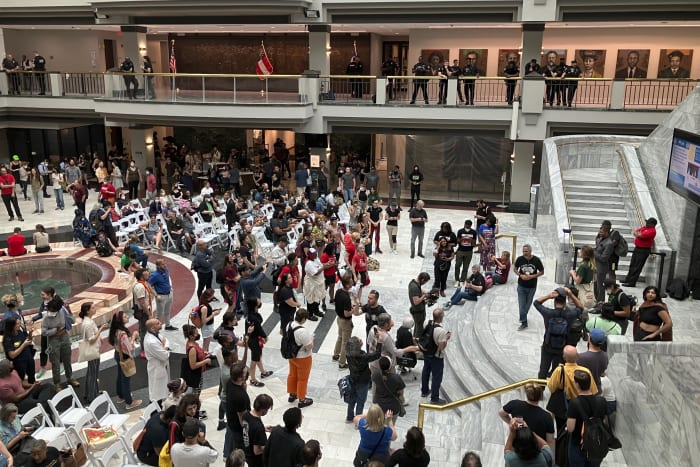 Stop Cop City Activists Pack Atlanta City Hall Ahead Of Crucial Vote