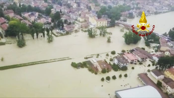 3 dead as heavy rains in northern Italy burst riverbanks, flood towns