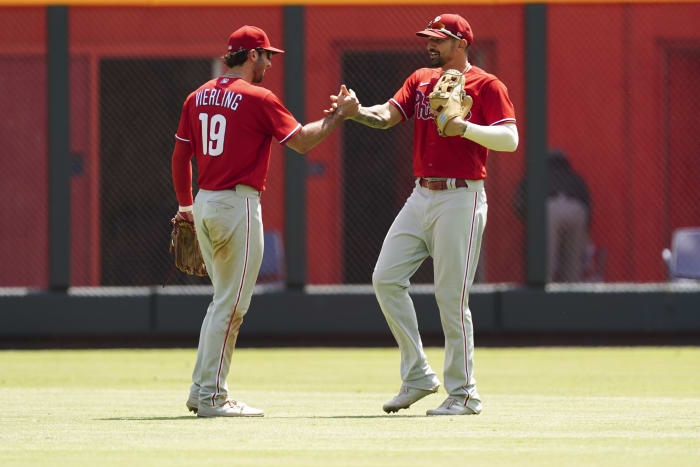 Braves score 4 in 11th, top Rockies 6-2, spoil uniform debut