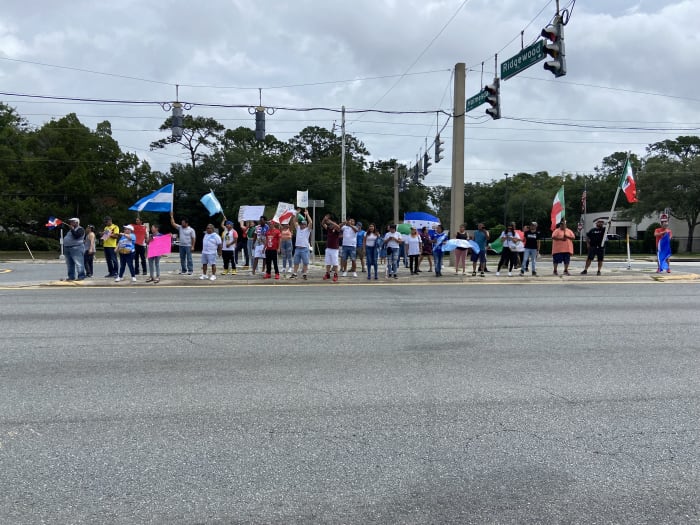 100+ people line Jacksonville street to protest new Florida immigration laws