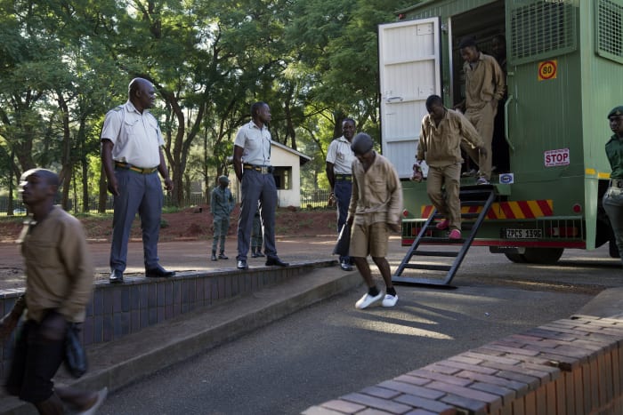 Zimbabwe authorities mix charm with force in an attempt to shore up the