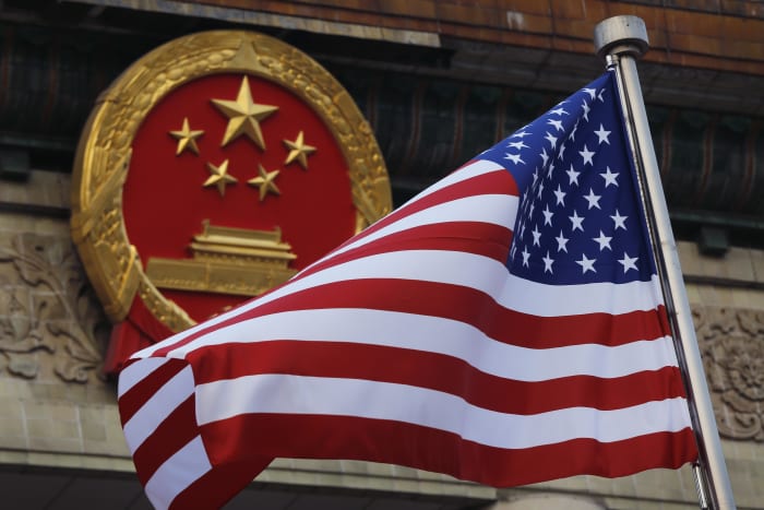 As world roils, US and China seek to ease strained ties and prepare for possible Biden-Xi summit