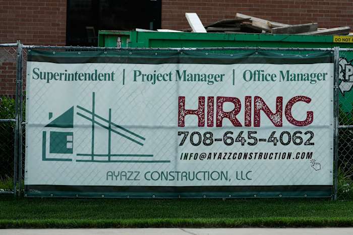 U.S. filings for jobless aid fall to 215,000 as layoffs remain at historically healthy levels