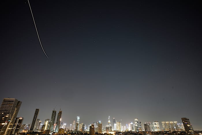 Iran targets Israel and Gulf Arab states even as Trump says US is in talks to end the war