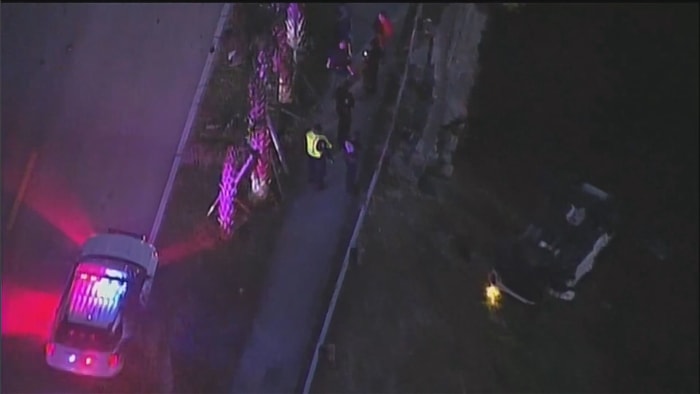 1 hospitalized after car overturns near canal in northwest Miami-Dade