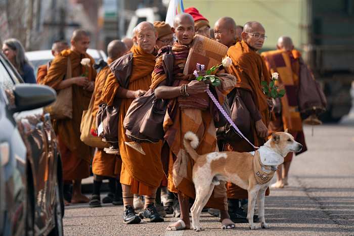 Buddhist monks and their dog captivate Americans while walking for peace