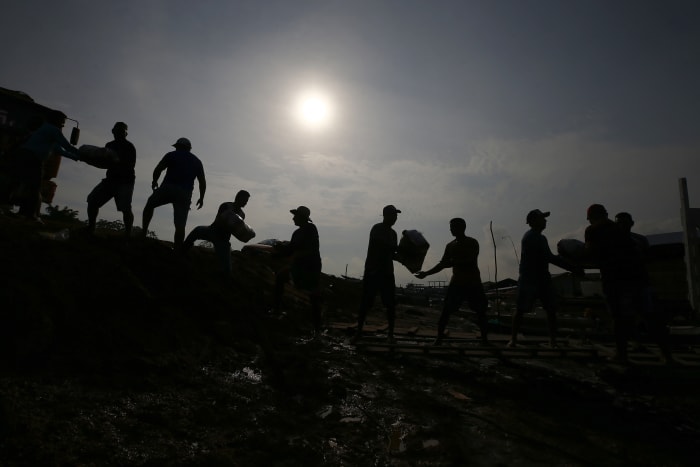 In the Amazon, communities next to the world's most voluminous river are queuing for water