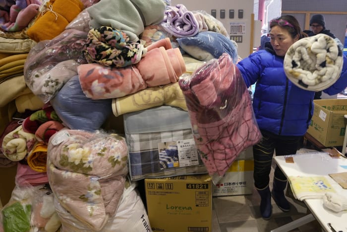 Thousands forced from homes by quake face stress and exhaustion as Japan mourns at least 161 deaths