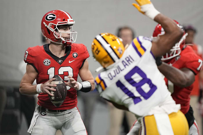 Beck throws and runs for TDs to launch new era as No. 1 Georgia